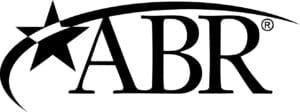 Close-up of a black and white text logo with the letters 'AB'.